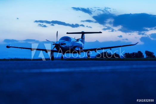 Picture of Single turboprop aircraft on evening runway